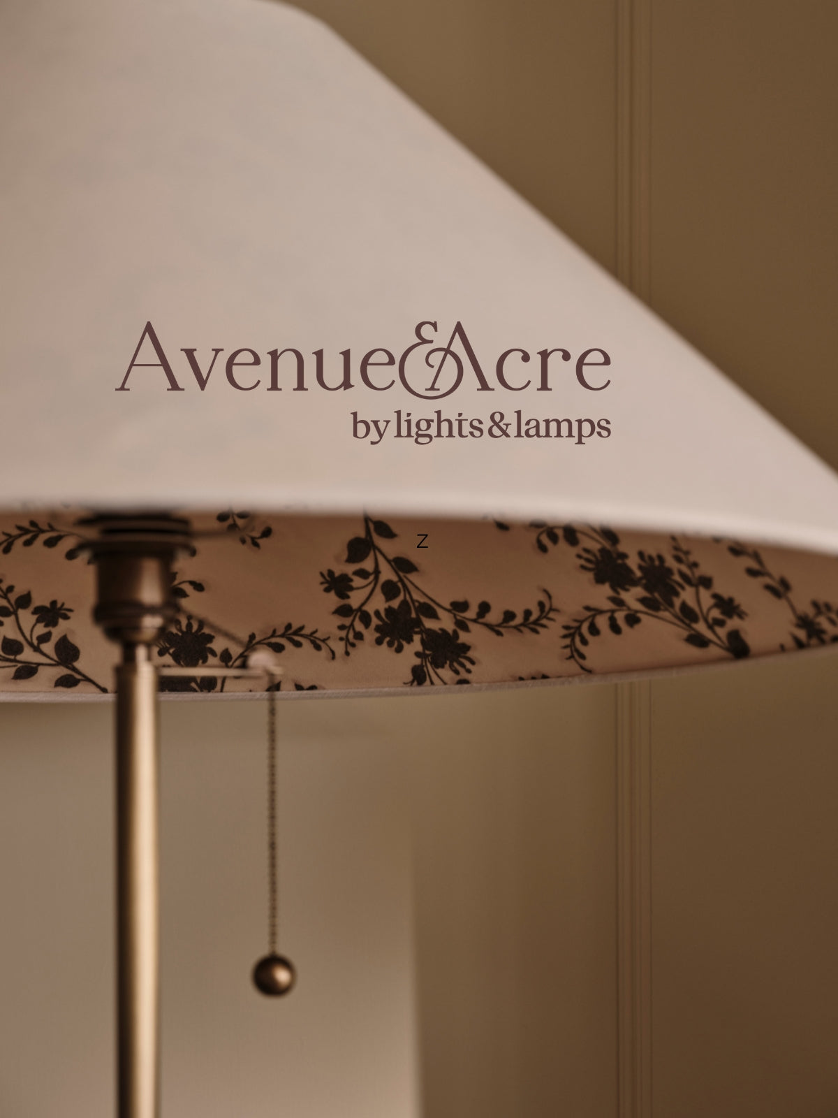 Lamp with floral patterned shade and 'Avenue & Acre by lights & lamps' branding.