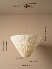 A pleated conical pendant light fixture in a warm cream or off-white shade, suspended from a brass ceiling canopy. The image features dimension lines and text overlays indicating the product's height, width, and the maximum height of the shade.