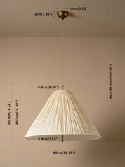A pleated conical pendant light shade in a warm cream or off-white tone, shown hanging against a beige wall with overlaid dimension labels and arrows indicating measurements in centimeters and inches.