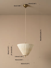 A hanging pendant light with a white pleated conical shade and a brass-toned ceiling mount and cord, shown against a plain beige wall with overlaid dimension labels and measurement lines.