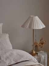 Lindi - aged brass and scalloped linen table lamp