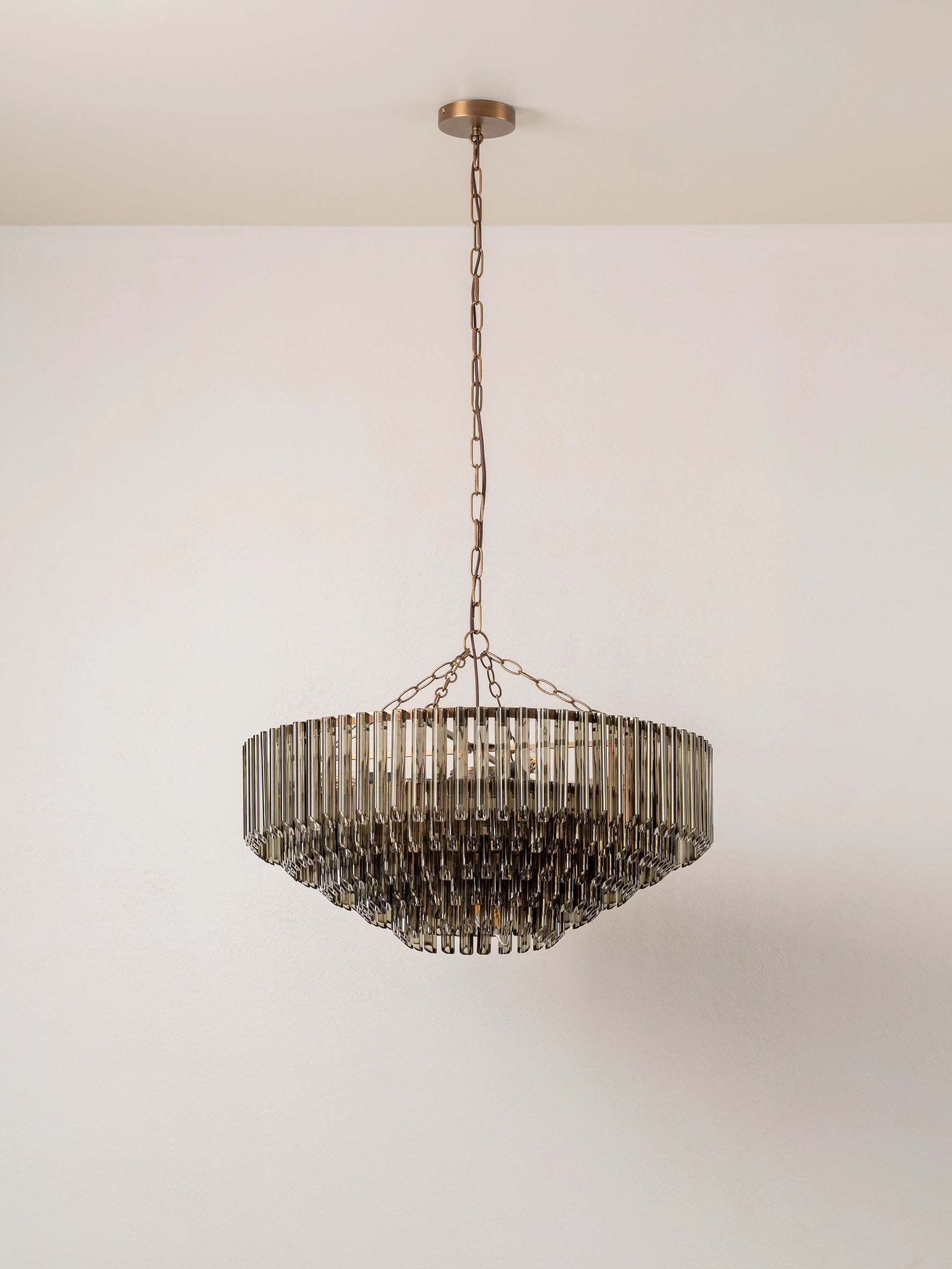 Petalia - 9 light aged brass and smoked green glass tube wide chandelier