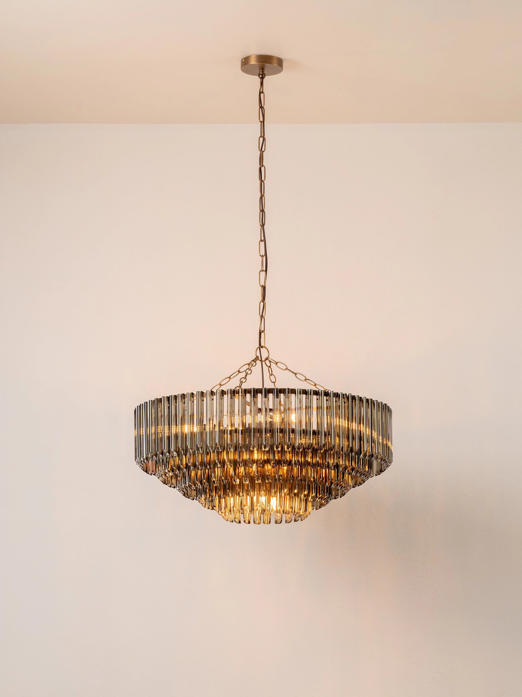 Petalia - 9 light aged brass and smoked green glass tube wide chandelier