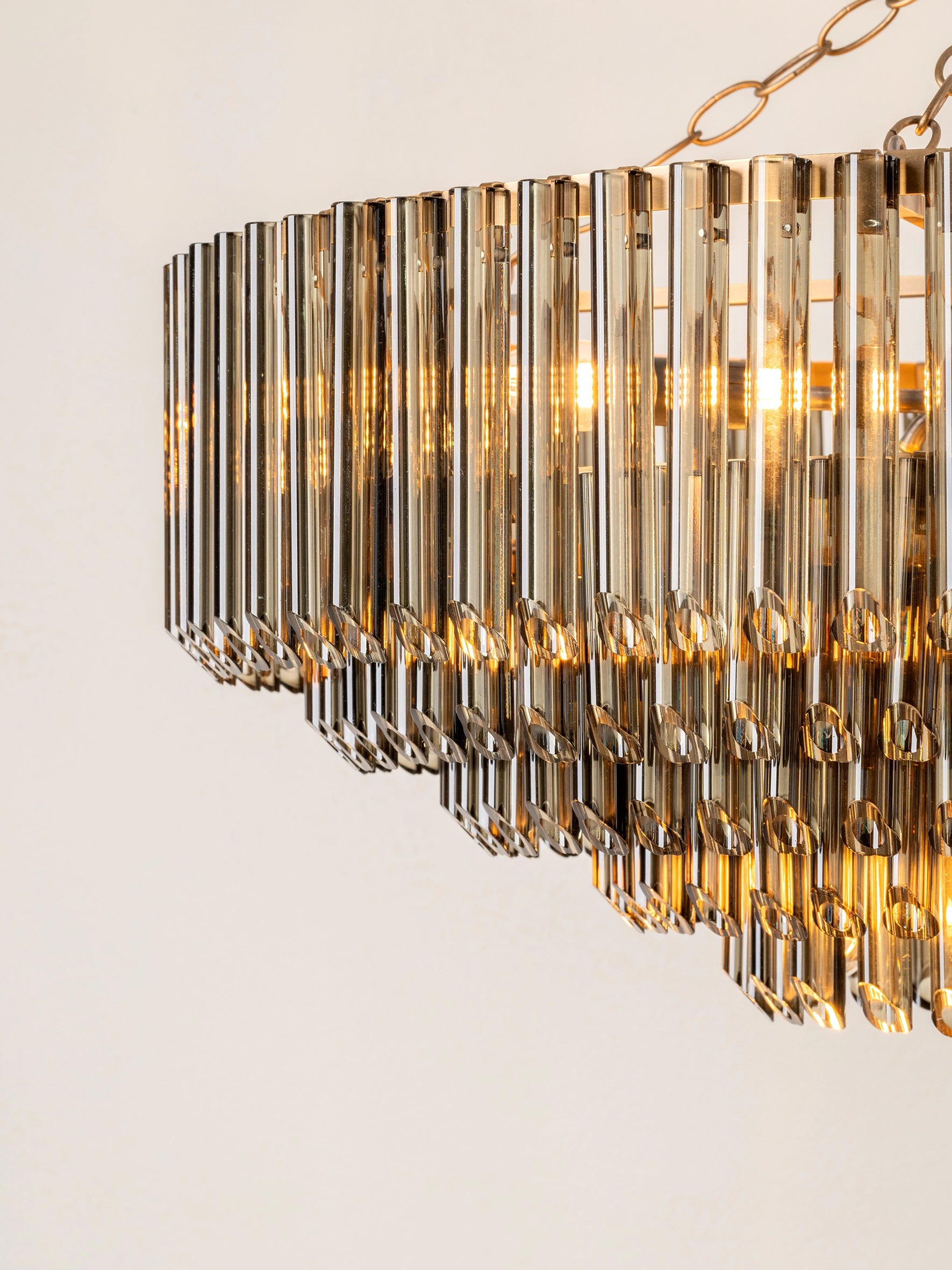 Petalia - 9 light aged brass and smoked green glass tube wide chandelier