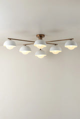 Porsa - 6 light aged brass and warm white porcelain flush