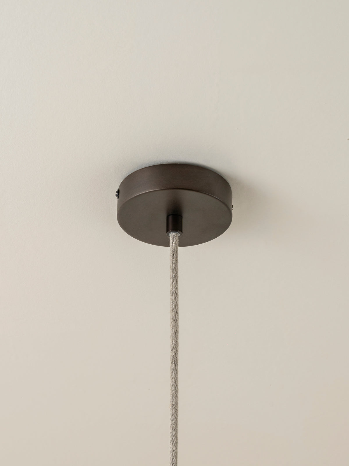 Solara - small dark bronze and layered natural linen pendant