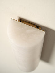 top of an alabaster wall light fixed to a wall