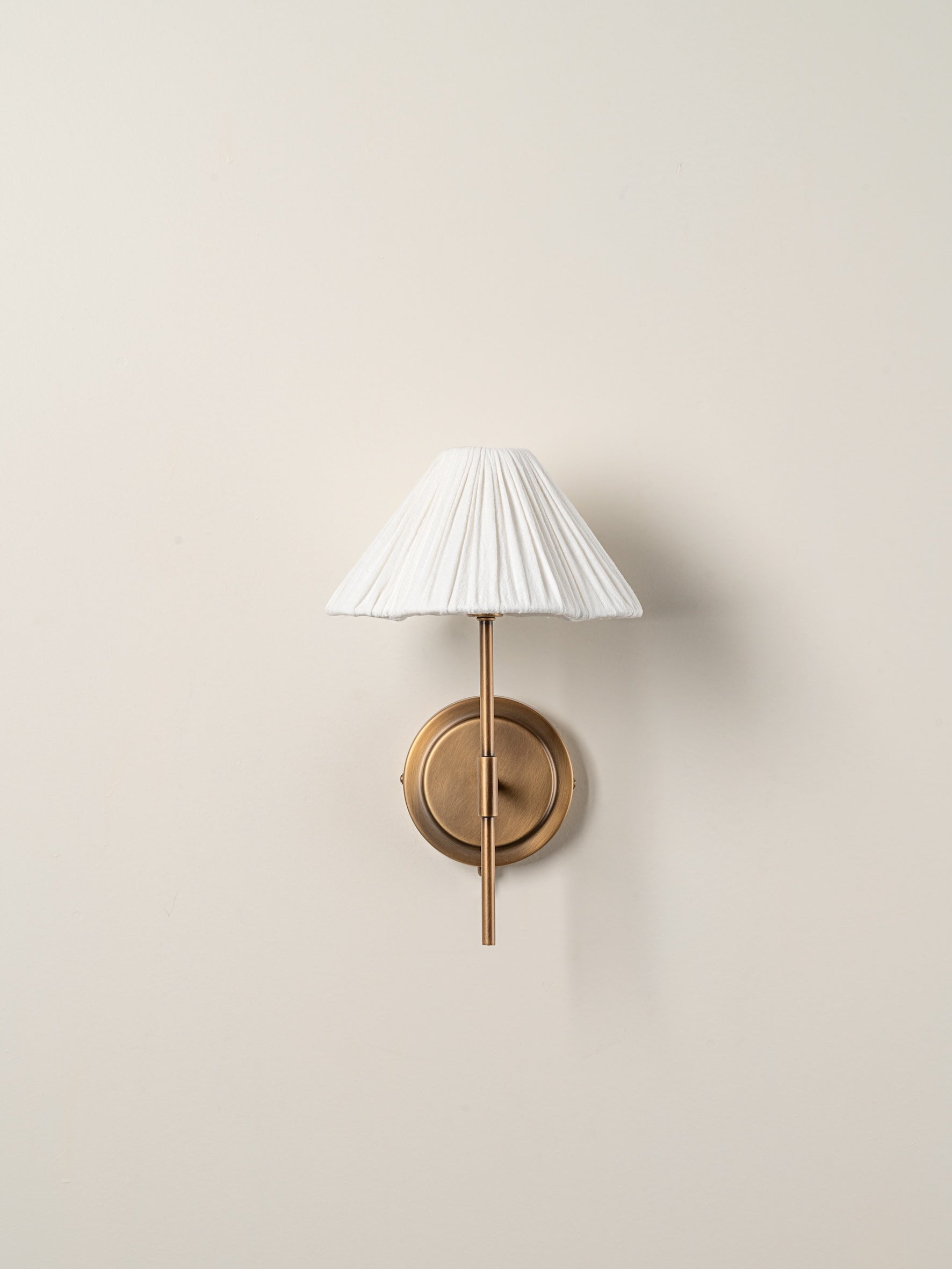 Lindi - aged brass and linen scalloped wall light | Wall Light | Lights & Lamps | UK | Modern Affordable Designer Lighting