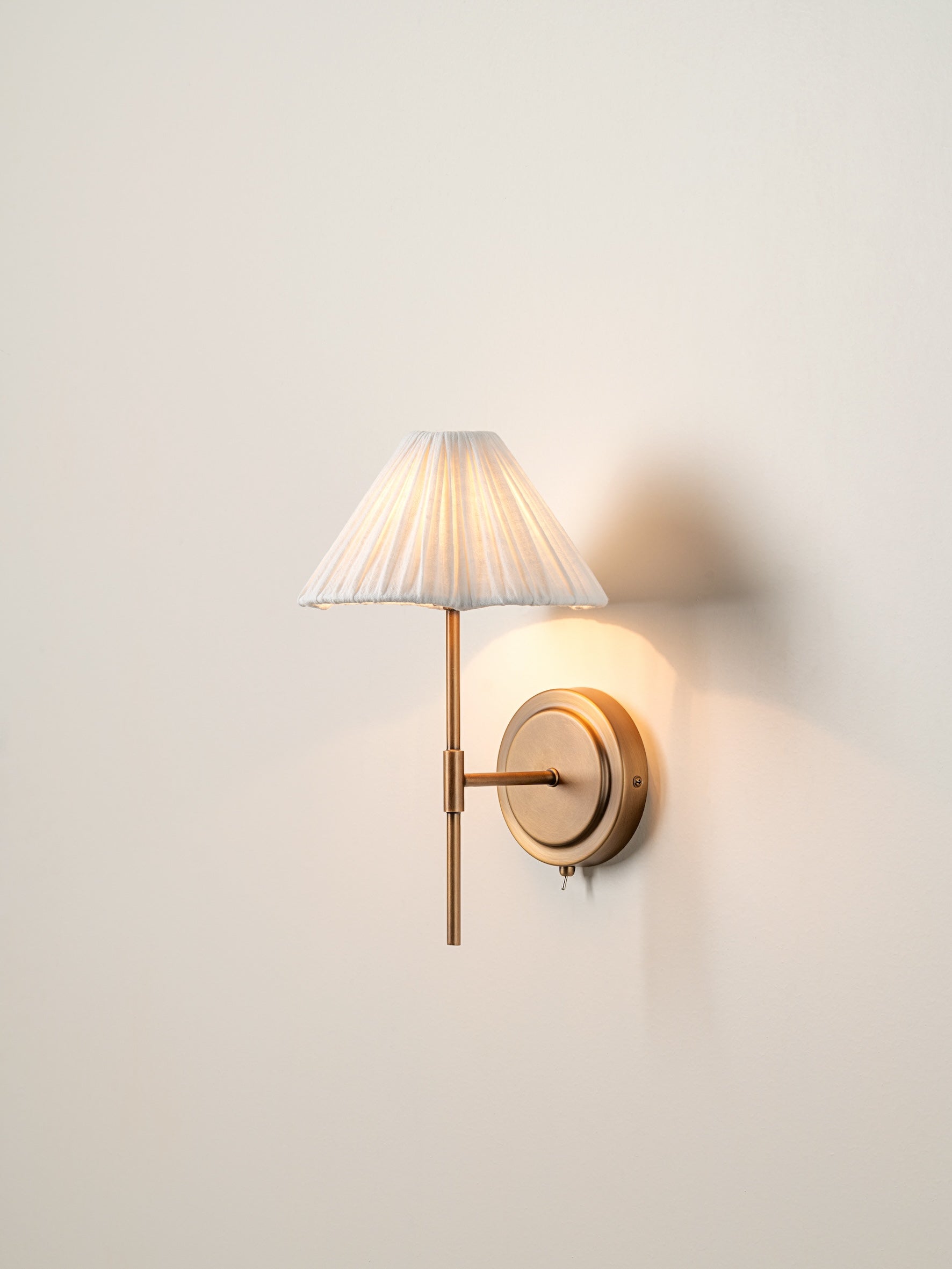 Lindi - aged brass and linen scalloped wall light | Wall Light | lights&lamps | UK | Modern Affordable Designer Lighting