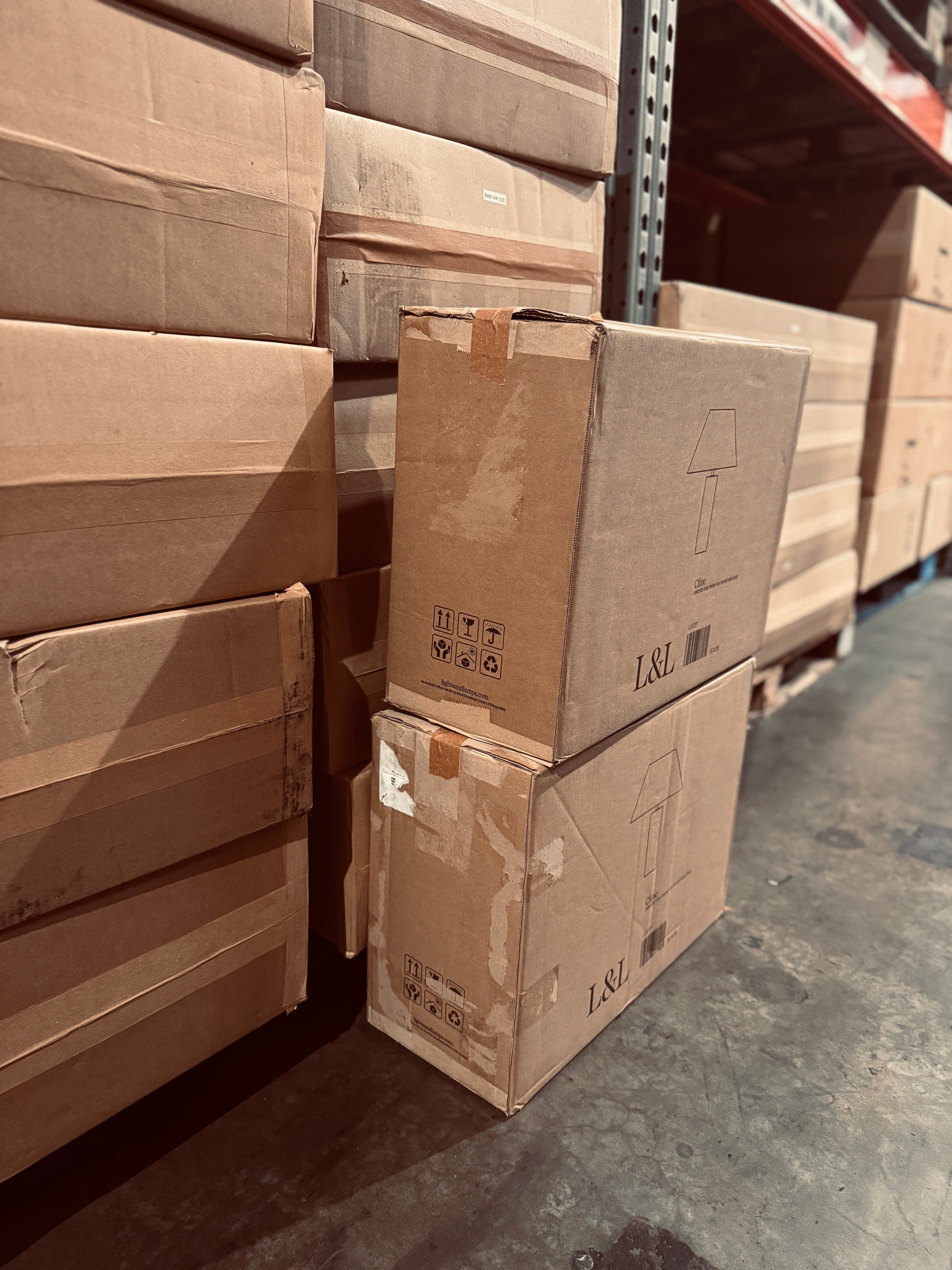 Stacks of cardboard boxes in a warehouse setting